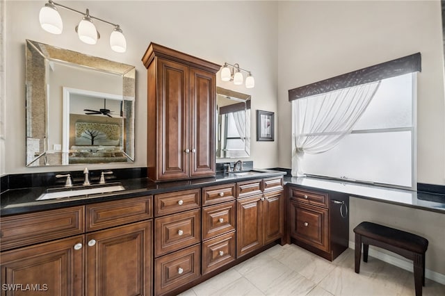 bathroom featuring double vanity, ensuite bath, and a sink