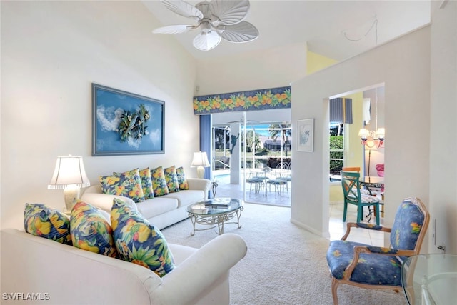 carpeted living room with high vaulted ceiling and ceiling fan