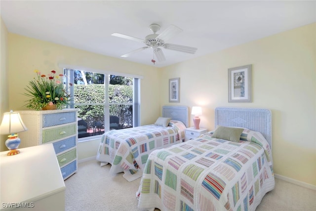 bedroom with ceiling fan and carpet