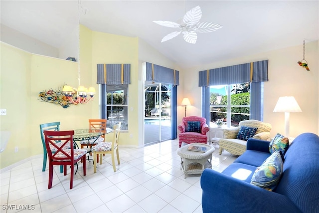 tiled living room featuring ceiling fan and vaulted ceiling