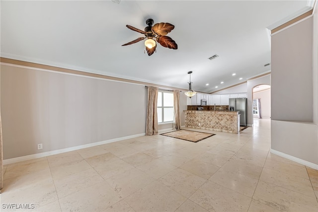 unfurnished living room featuring crown molding, ceiling fan, and lofted ceiling