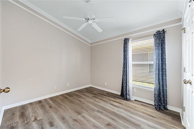 unfurnished room featuring crown molding, ceiling fan, and light wood-type flooring