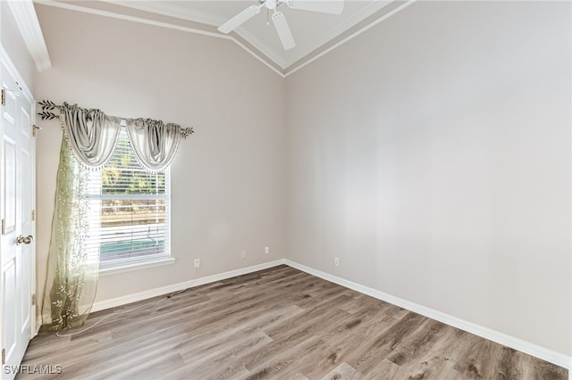 unfurnished room with ceiling fan, ornamental molding, wood-type flooring, and vaulted ceiling