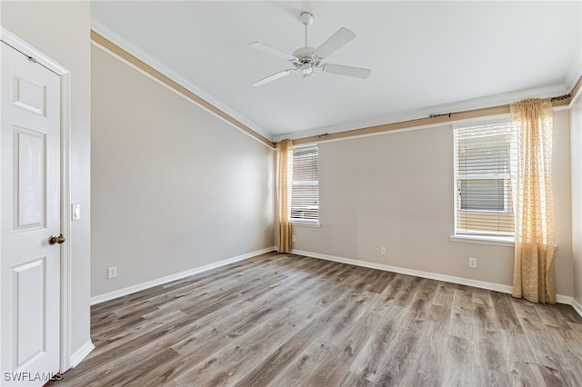 unfurnished room with crown molding, ceiling fan, lofted ceiling, and light hardwood / wood-style flooring