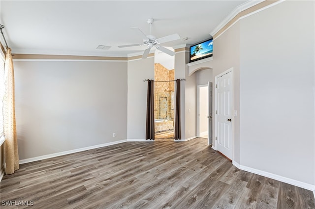 interior space featuring crown molding, hardwood / wood-style floors, and ceiling fan