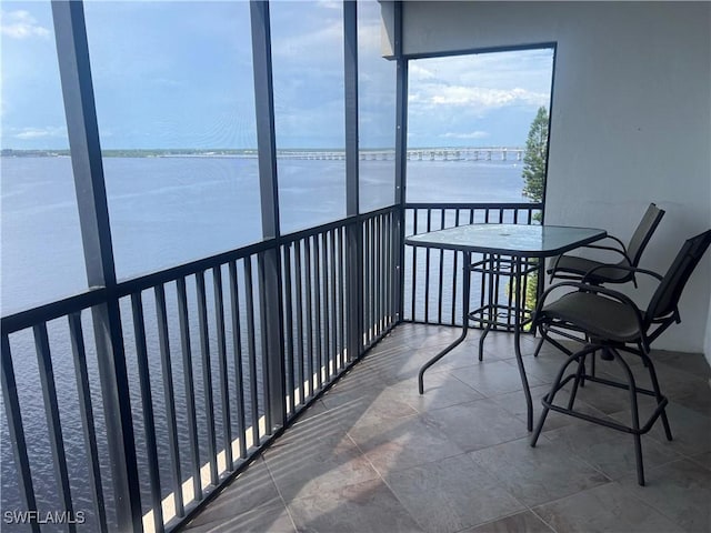 sunroom with a water view