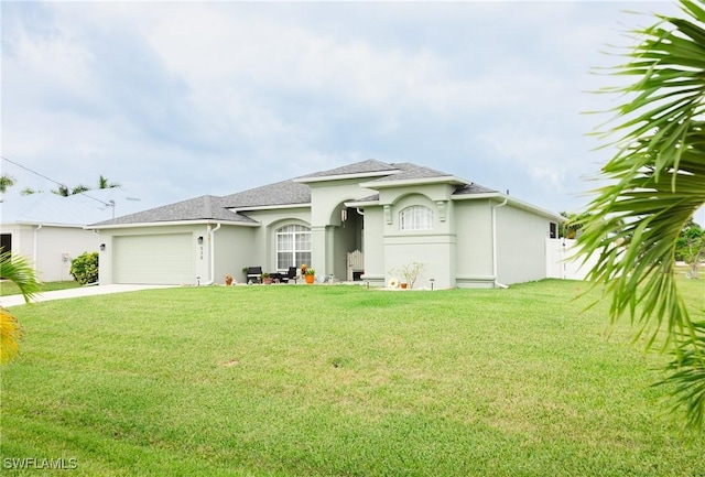 view of front facade with a garage and a front lawn