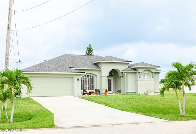 view of front facade featuring a garage and a front lawn