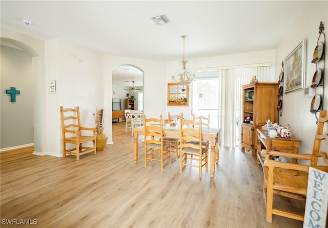 dining area featuring ceiling fan and light wood-type flooring