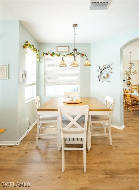 dining space featuring breakfast area and hardwood / wood-style flooring