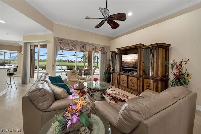 living room with light tile patterned floors, crown molding, and ceiling fan