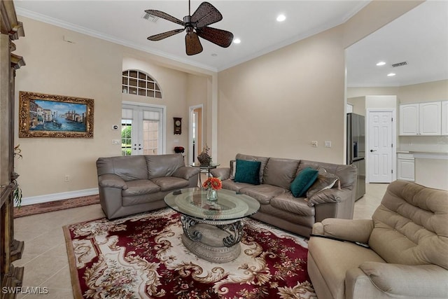 tiled living room with crown molding, ceiling fan, and french doors