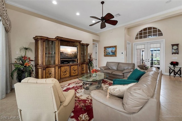 tiled living room featuring crown molding, ceiling fan, and french doors