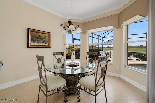 tiled dining area with a water view, ornamental molding, and an inviting chandelier