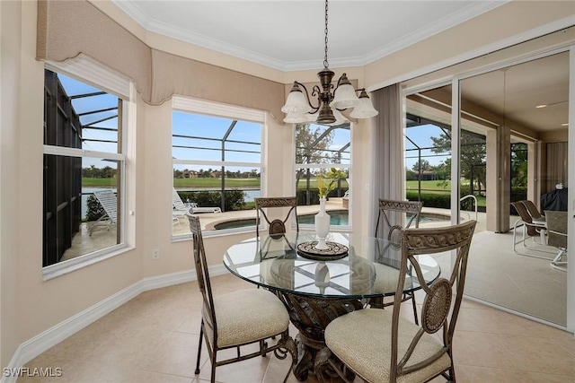 tiled dining space with crown molding, a water view, and an inviting chandelier