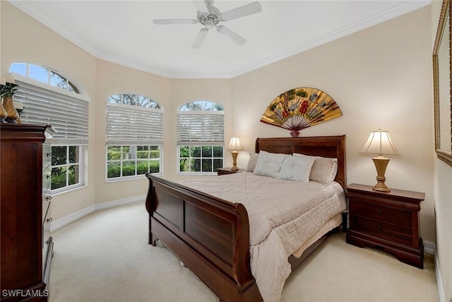 carpeted bedroom with crown molding, ceiling fan, and multiple windows