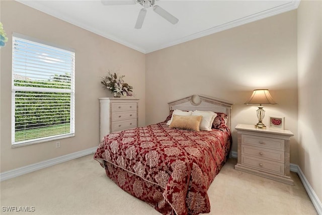 bedroom with crown molding, light colored carpet, and ceiling fan