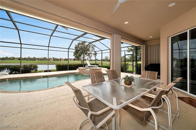 view of swimming pool with a water view, a patio, glass enclosure, and an in ground hot tub