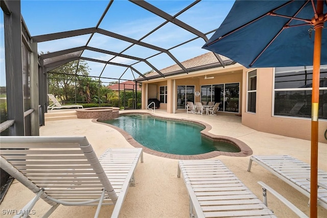 view of swimming pool featuring an in ground hot tub, a patio, and glass enclosure