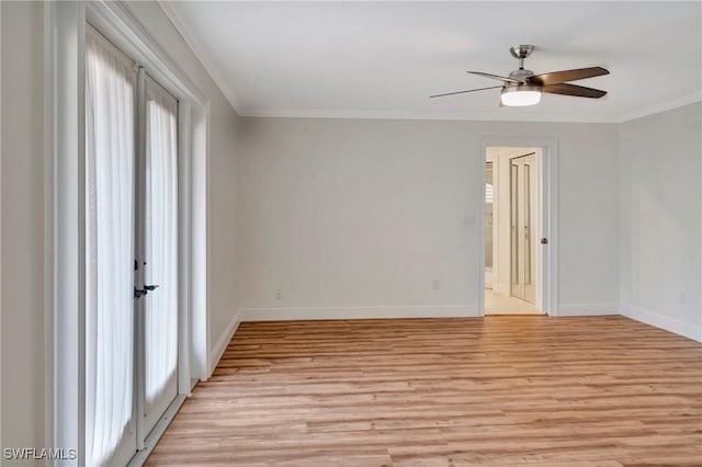 spare room with ornamental molding, ceiling fan, and light wood-type flooring