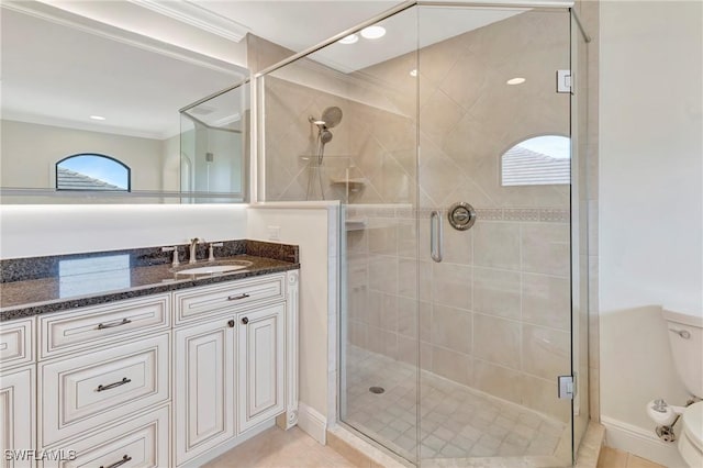 bathroom featuring vanity, an enclosed shower, and tile patterned flooring