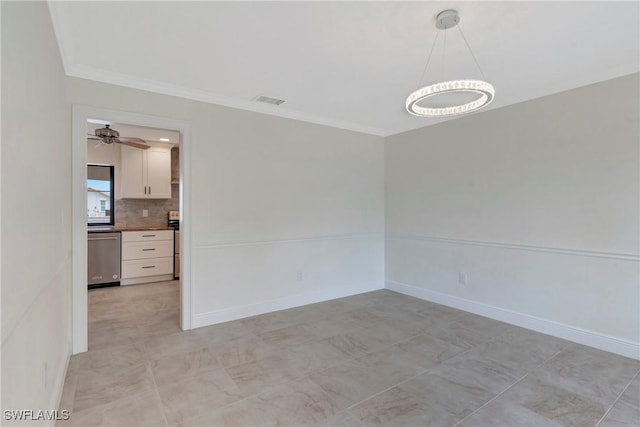 empty room featuring ornamental molding