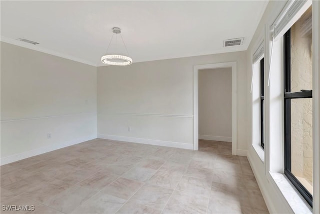 unfurnished room featuring ornamental molding