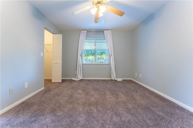 unfurnished bedroom featuring carpet, ceiling fan, and baseboards