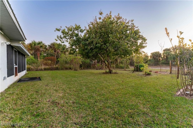 view of yard featuring a sunroom