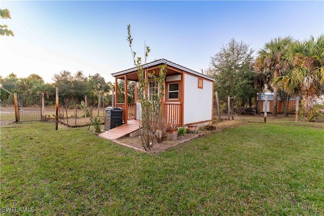 view of shed featuring fence