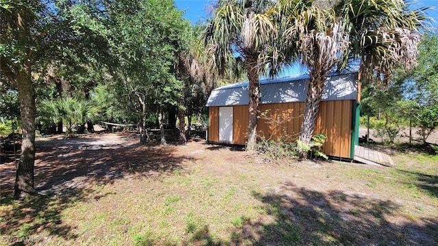 3054 NE Beechwood Cir, Labelle, FL 33935 - view of yard with an outdoor structure and a shed