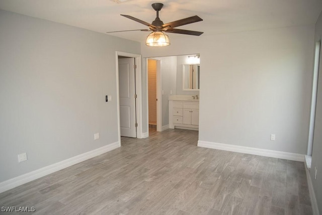 17291 Timber Oak Ln, Fort Myers, FL 33908 - unfurnished bedroom with ceiling fan, sink, light hardwood / wood-style floors, and ensuite bath