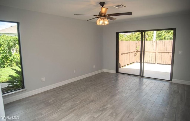 17291 Timber Oak Ln, Fort Myers, FL 33908 - spare room with ceiling fan and wood-type flooring