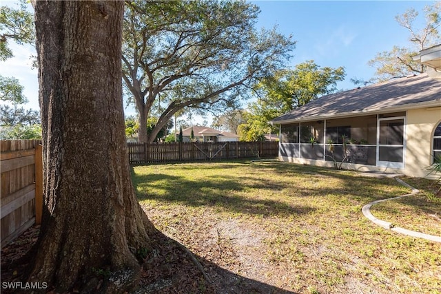 view of yard with a sunroom