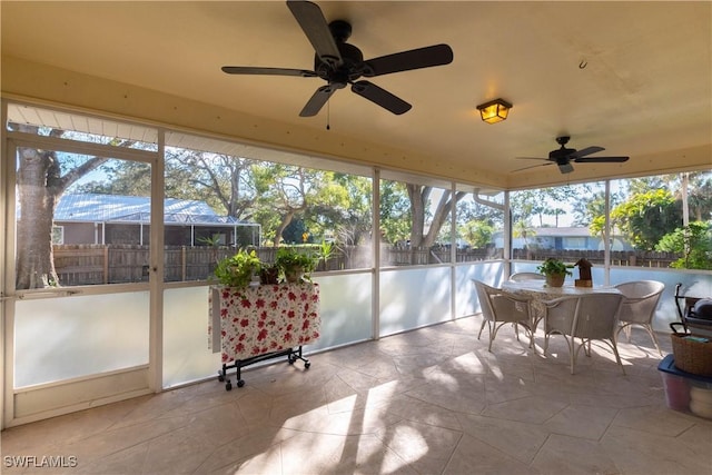 sunroom / solarium with ceiling fan and a wealth of natural light