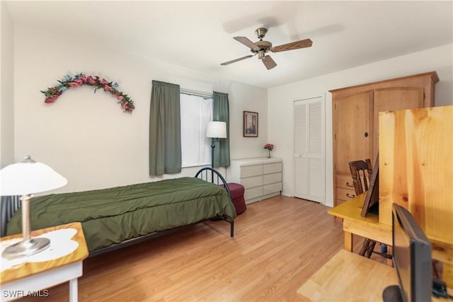 bedroom featuring a closet, ceiling fan, and light hardwood / wood-style flooring