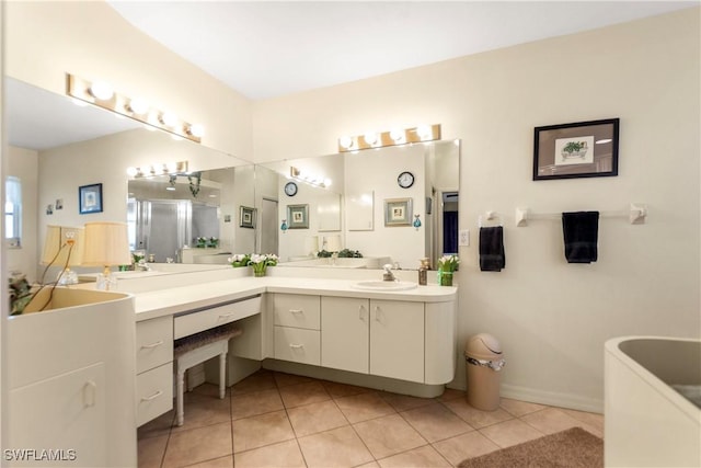 bathroom featuring independent shower and bath, vanity, and tile patterned floors