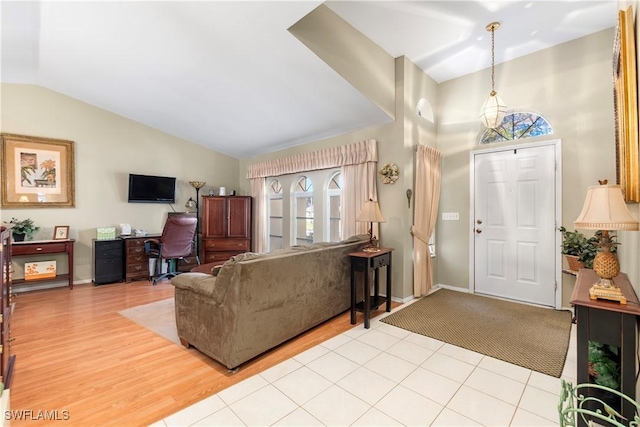 living room with vaulted ceiling and light hardwood / wood-style floors