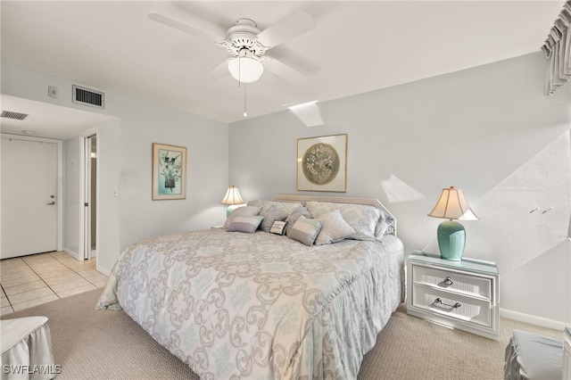 bedroom featuring light tile patterned flooring and ceiling fan