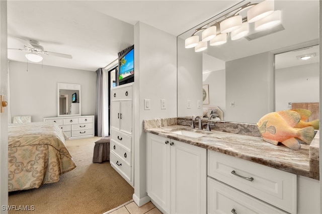 bathroom featuring vanity, tile patterned flooring, and ceiling fan