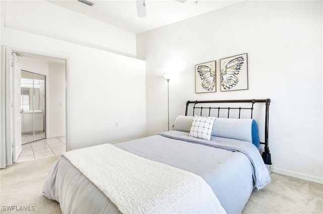 3260 Douglas Dr Unit 204, Naples, FL 34105 - bedroom with connected bathroom, a ceiling fan, light colored carpet, and baseboards