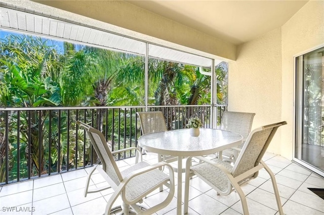 3260 Douglas Dr Unit 204, Naples, FL 34105 - balcony featuring outdoor dining space