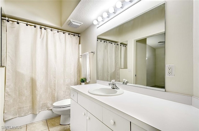 3260 Douglas Dr Unit 204, Naples, FL 34105 - bathroom with vanity, shower / bath combo with shower curtain, tile patterned floors, toilet, and visible vents