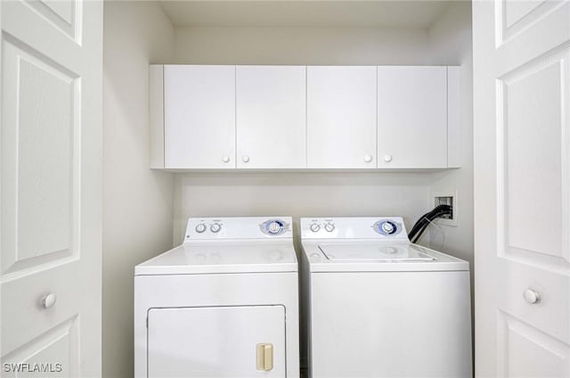 3260 Douglas Dr Unit 204, Naples, FL 34105 - washroom with washer and dryer and cabinet space