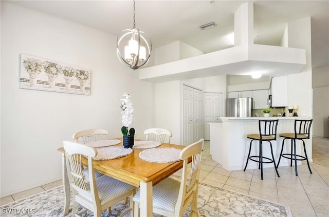 3260 Douglas Dr Unit 204, Naples, FL 34105 - dining room with a chandelier, visible vents, light tile patterned floors, and a towering ceiling