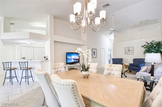 3260 Douglas Dr Unit 204, Naples, FL 34105 - dining space with light tile patterned floors, visible vents, high vaulted ceiling, and ceiling fan with notable chandelier