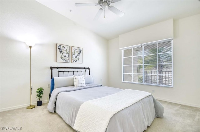 3260 Douglas Dr Unit 204, Naples, FL 34105 - bedroom featuring baseboards, light carpet, ceiling fan, and vaulted ceiling