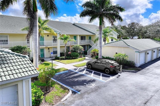 3260 Douglas Dr Unit 204, Naples, FL 34105 - view of property featuring uncovered parking