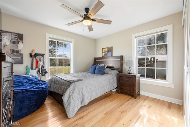 bedroom featuring ceiling fan and light hardwood / wood-style floors