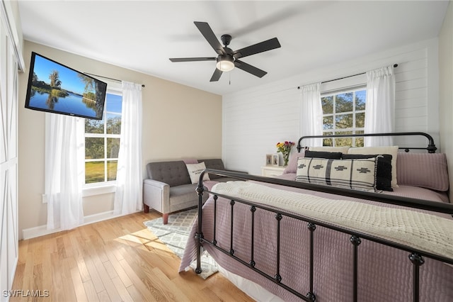 bedroom featuring ceiling fan and light hardwood / wood-style floors